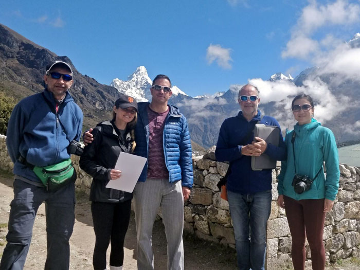 members with mountain backgroud